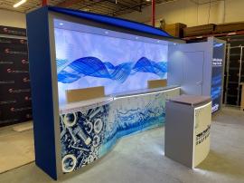 Custom Inline Exhibit with Backlit Fabric Graphics, Backwall Curved Counter, Vinyl Graphics. Puck Lights, Closet Storage, and ECO-52 C Counter with LED Accent Lights